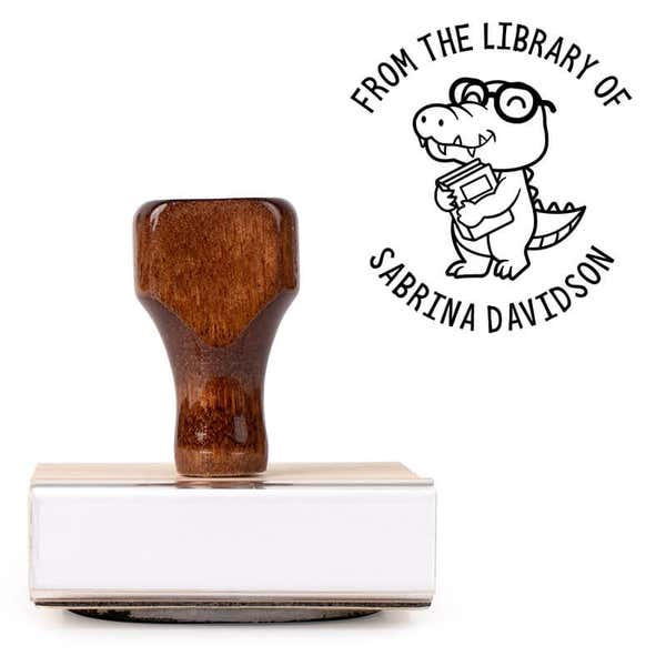 Front view of wood handle stamp body with library book stamp impression