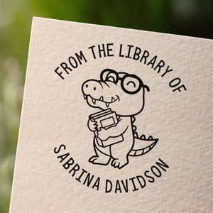 Personalized book stamp impression on white paper