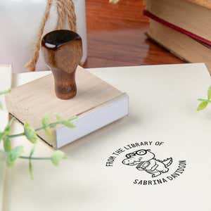 Custom book stamp on paper with wood handle stamp body