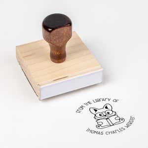 Wood handle stamp body with book stamp impression