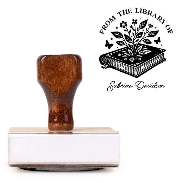 Front view of wood handle stamp body with library book stamp impression