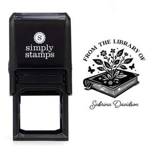 Front view of self-inking stamp body with library book stamp impression example