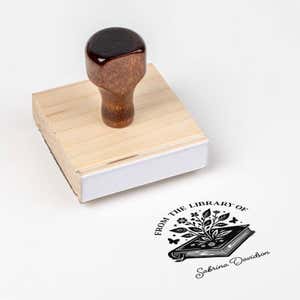 Wood handle stamp body with book stamp impression