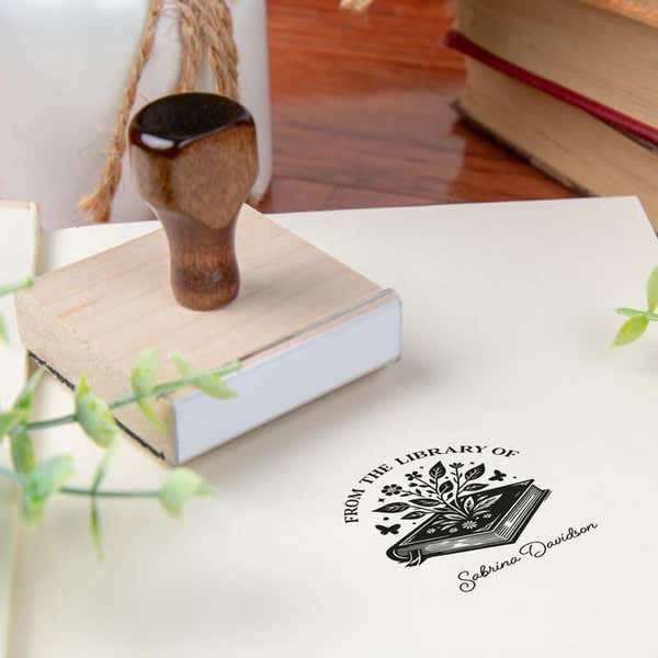 Custom book stamp on paper with wood handle stamp body