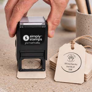 Open Circle Round Logo Stamp resting beside a freshly stamped custom logo impression