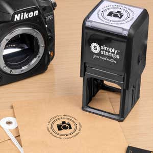 Orbital Round Logo Address Stamp in use, with a stamped logo impression on packaging