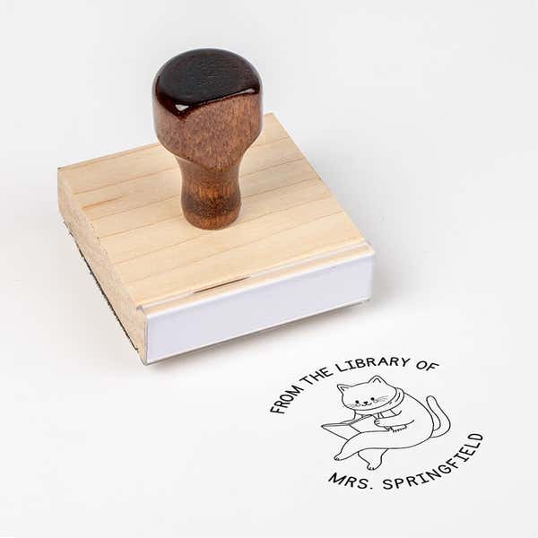 Wood handle stamp body with book stamp impression