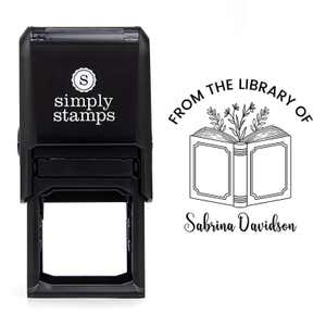 Front view of self-inking stamp body with library book stamp impression example
