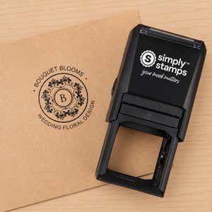 Custom Round Rubber Logo Stamp in use, with a stamped logo impression on packaging
