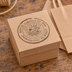 Broken Circle Round Logo Stamp in use, with a stamped logo impression on packaging