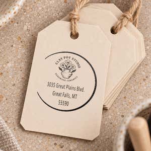 Open Circle Round Logo Stamp resting beside a freshly stamped custom logo impression