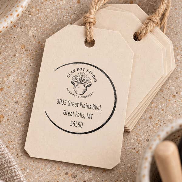 Open Circle Round Logo Stamp resting beside a freshly stamped custom logo impression