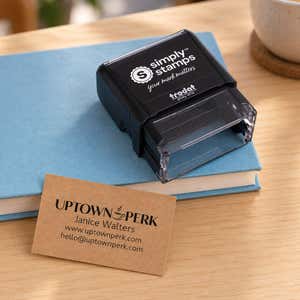 Custom Rectangle Logo Stamp with 3 Lines of Text in use, with a stamped logo impression on packaging
