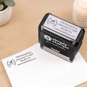 Double Ring Rectangle Logo Stamp in use, with a stamped logo impression on packaging (second view)