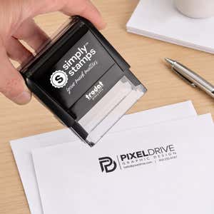 Custom Medium Rectangle Logo Stamp in use, with a stamped logo impression on packaging
