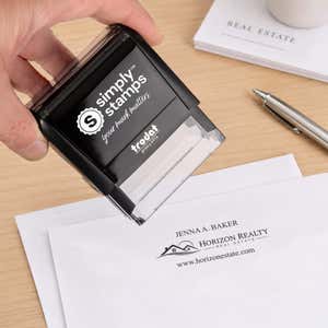 Custom Text Above and Below Rectangle Logo Stamp in use, with a stamped logo impression on packaging