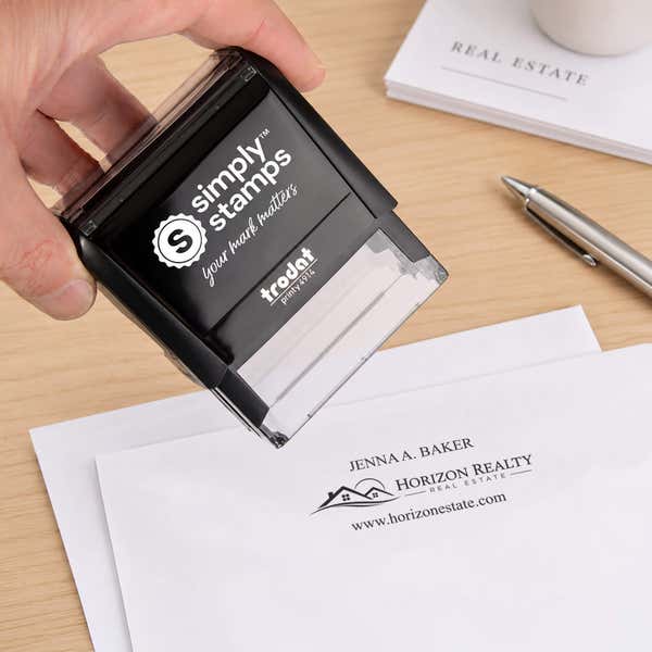 Custom Text Above and Below Rectangle Logo Stamp in use, with a stamped logo impression on packaging