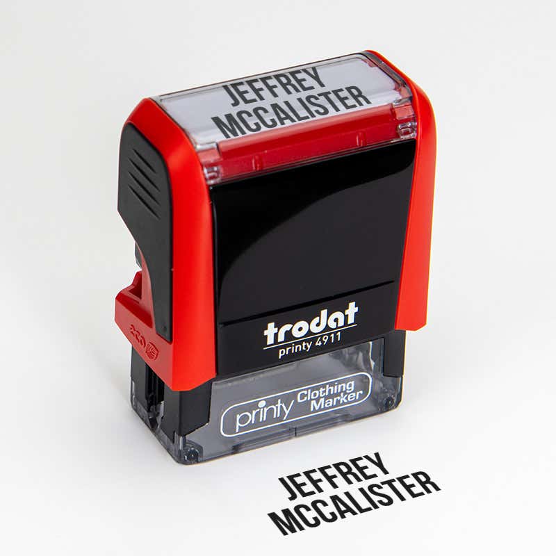 Angled View of Bold 2 Line Name Stamp Impression on White Background with 4911 Stamp Body