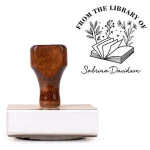 Front view of wood handle stamp body with library book stamp impression