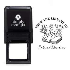 Front view of self-inking stamp body with library book stamp impression example