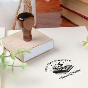 Custom book stamp on paper with wood handle stamp body
