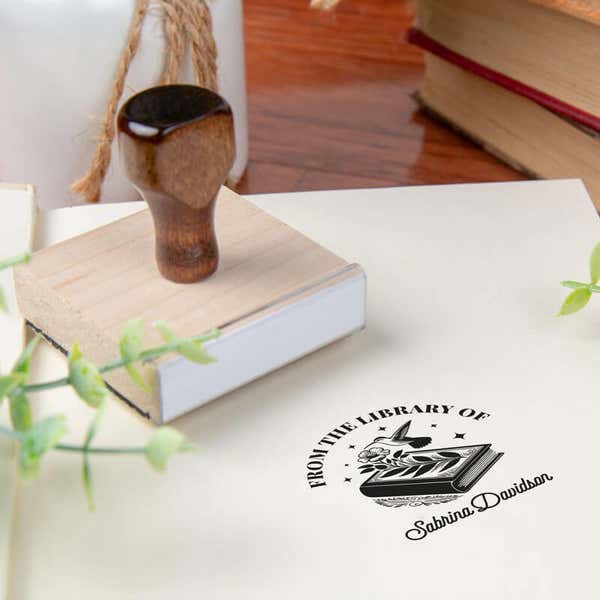 Custom book stamp on paper with wood handle stamp body