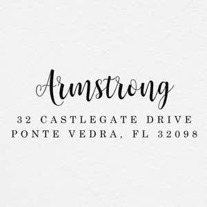 Impression of the Armstrong Address Stamp on grey textured paper
