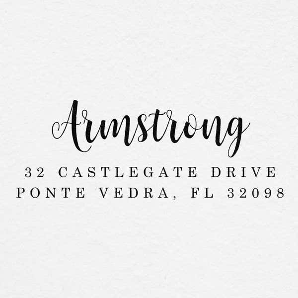 Impression of the Armstrong Address Stamp on grey textured paper