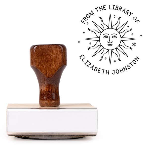 Front view of wood handle stamp body with library book stamp impression