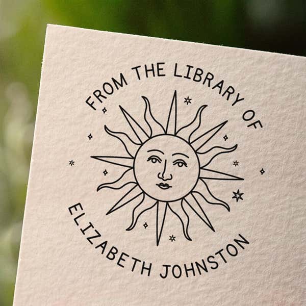 Personalized book stamp impression on white paper