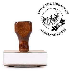 Front view of wood handle stamp body with library book stamp impression