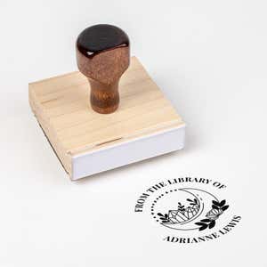 Wood handle stamp body with book stamp impression
