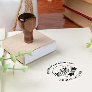 Custom book stamp on paper with wood handle stamp body