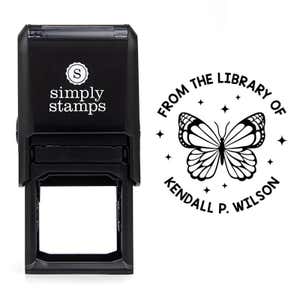 Front view of self-inking stamp body with library book stamp impression example