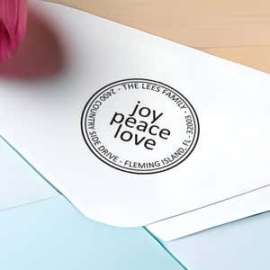 Joy Peace Love Round Address Stamp impression close up on envelope