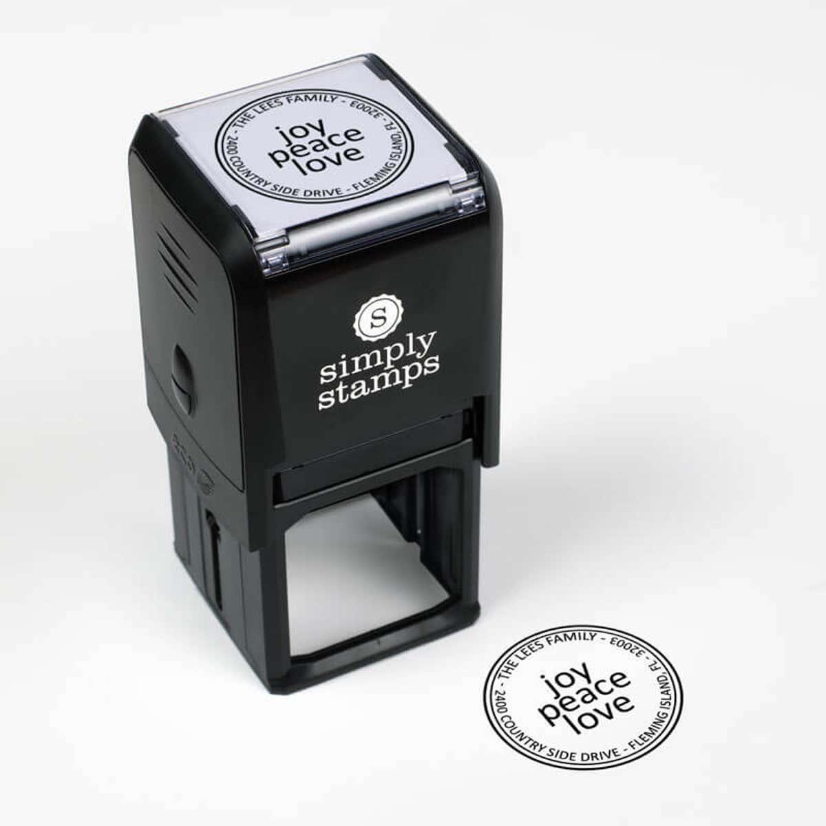 Joy Peace Love Round Address Stamp impression next to self inking stamp body