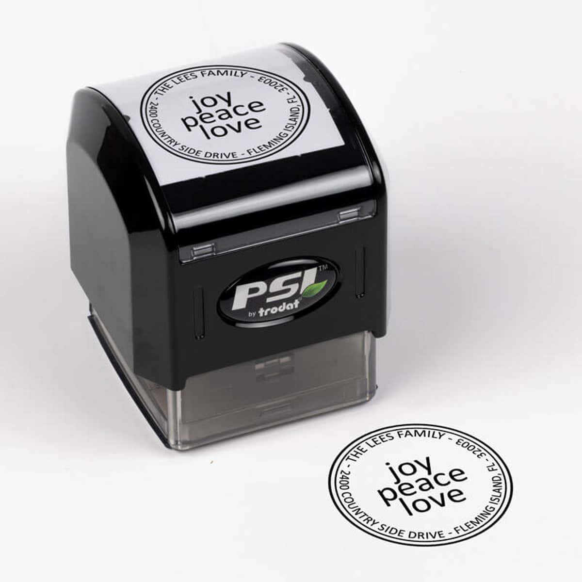Joy Peace Love Round Address Stamp impression next to pre inked stamp body