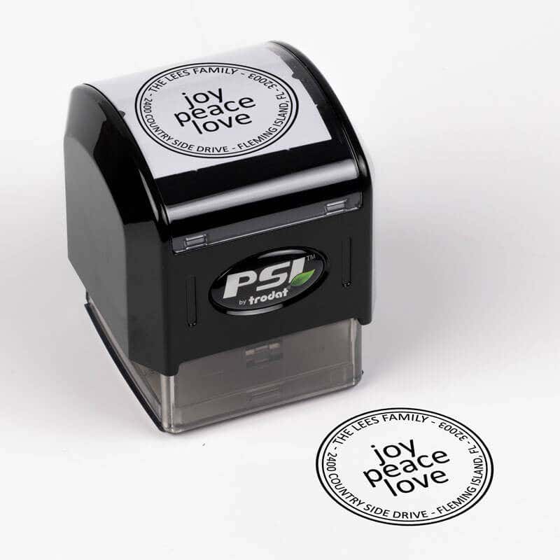 Joy Peace Love Round Address Stamp impression next to pre inked stamp body