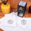 Price Curves Square Address Stamp design impression on two envelopes next to self inking stamp body