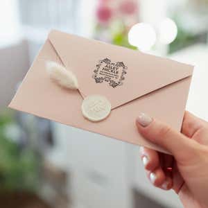Hickle Curves Square Address Stamp on back of envelope in hand