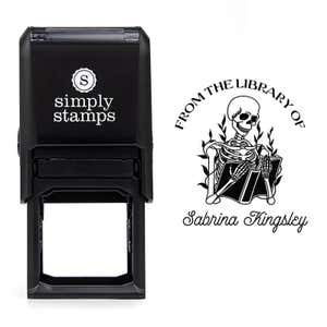 Front view of self-inking stamp body with library book stamp impression example