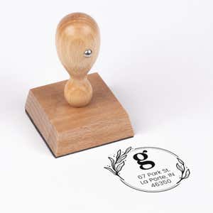 Elegant Botanical Monogram Address Stamp impression next to european stamp body