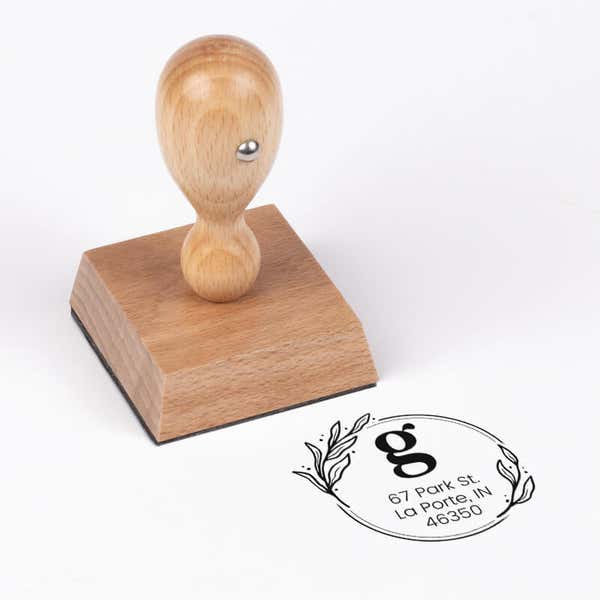 Elegant Botanical Monogram Address Stamp impression next to european stamp body