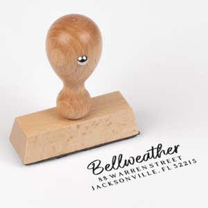 Brush Script Address Stamp impression next to european stamp body