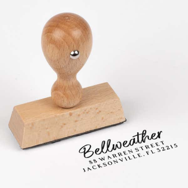 Brush Script Address Stamp impression next to european stamp body