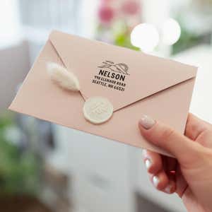 Mountain Custom Return Address Stamp on back of envelope in hand