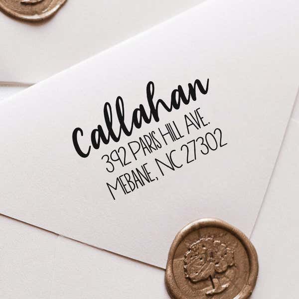 Fully Customizable Script Name Return Address Stamp impression close up on white envelope