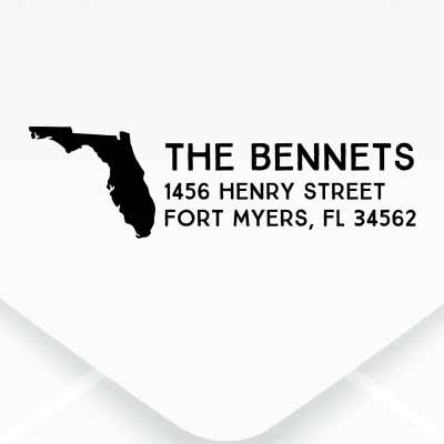 The impression made from the Dupont Brush Return Address Stamp on grey paper
