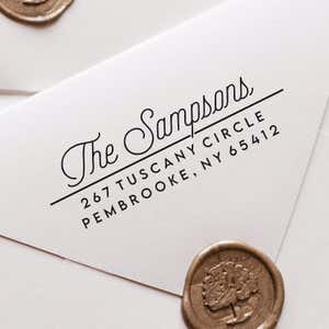 Sampson Script Return Address Stamp impression close up on white envelope