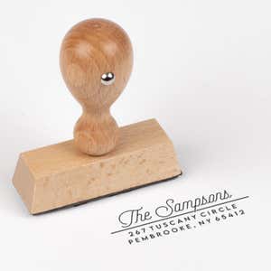 Sampson Script Return Address Stamp impression next to european stamp body